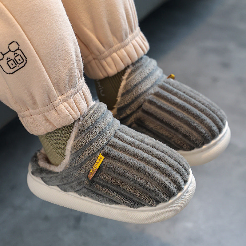 A child wearing Comfeo open-back plush slippers